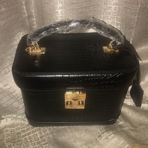 Black handbag with gold hardware